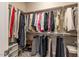 Spacious walk-in closet with built-in shelving and storage for clothes, shoes, and accessories at 6612 Enrichment Ln, Raleigh, NC 27616