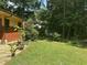 Backyard featuring a lush lawn and mature trees, perfect for outdoor entertaining at 71010 Russell, Chapel Hill, NC 27517
