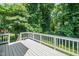 Spacious outdoor deck perfect for relaxing and entertaining in a private wooded setting at 725 E Maple Ln, Fuquay Varina, NC 27526