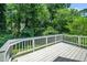 Private outdoor deck overlooking a wooded area at 725 E Maple Ln, Fuquay Varina, NC 27526