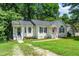A charming home with great curb appeal, featuring a lush lawn and inviting entrance at 725 E Maple Ln, Fuquay Varina, NC 27526