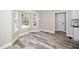 Inviting living area showcasing large windows and modern flooring at 725 E Maple Ln, Fuquay Varina, NC 27526