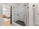 Bathroom showing a glass enclosed shower and access to a bedroom at 807 Edmund St, Raleigh, NC 27604