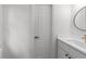 White bathroom with a sink featuring modern fixtures and a door at 807 Edmund St, Raleigh, NC 27604