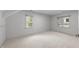 Bright bedroom with neutral carpeting, ample natural light, and recessed lighting at 807 Edmund St, Raleigh, NC 27604
