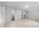 Bright bedroom featuring three doors and windows at 807 Edmund St, Raleigh, NC 27604