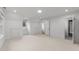 Bright bedroom with neutral carpet, dormer windows, and attached bathroom at 807 Edmund St, Raleigh, NC 27604