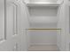 White walk in closet space with wood racks at 807 Edmund St, Raleigh, NC 27604