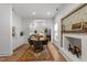 Bright dining room open to the living room offers a decorative fireplace and stylish furnishings at 807 Edmund St, Raleigh, NC 27604