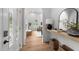 Bright entryway showcases hardwood floors, high ceilings, and a glimpse of the living room at 807 Edmund St, Raleigh, NC 27604