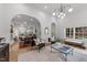 Open-concept living room showcasing natural light, arched entryways, and hardwood floors at 807 Edmund St, Raleigh, NC 27604