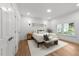 Calm main bedroom featuring hardwood floors, neutral tones, and natural light at 807 Edmund St, Raleigh, NC 27604