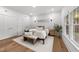 Bright main bedroom features hardwood floors, neutral tones, and ample natural light at 807 Edmund St, Raleigh, NC 27604