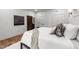 Comfortable main bedroom showcasing a decorative accent wall and ensuite bathroom at 807 Edmund St, Raleigh, NC 27604