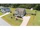 This lovely home has a long drive and is surrounded by beautiful properties at 85 Twelve Oaks Dr, Willow Springs, NC 27592