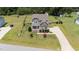 Charming property with mature trees, a fenced backyard, and a long driveway at 85 Twelve Oaks Dr, Willow Springs, NC 27592