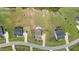 Aerial view of houses in a neighborhood, showcasing a well-maintained lawn and a circular driveway at 85 Twelve Oaks Dr, Willow Springs, NC 27592
