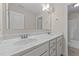Bathroom featuring a dual sink vanity with marble countertop and white cabinetry at 85 Twelve Oaks Dr, Willow Springs, NC 27592