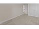 Bedroom with neutral walls and carpet, featuring two doors, and ample natural light at 85 Twelve Oaks Dr, Willow Springs, NC 27592