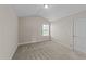 Bedroom with neutral walls, carpet, and a large window letting in ample natural light at 85 Twelve Oaks Dr, Willow Springs, NC 27592