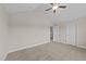 A comfortable bedroom with neutral walls and carpet, featuring a ceiling fan at 85 Twelve Oaks Dr, Willow Springs, NC 27592