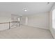 Spacious bonus room with neutral carpet, white walls, and ample natural light at 85 Twelve Oaks Dr, Willow Springs, NC 27592