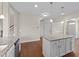 Kitchen features granite countertops, a center island with storage, and stainless steel appliances at 85 Twelve Oaks Dr, Willow Springs, NC 27592