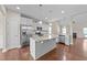 Modern kitchen features stainless steel appliances and a large center island at 85 Twelve Oaks Dr, Willow Springs, NC 27592