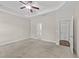 Spacious main bedroom with neutral carpet, tray ceiling, and ample natural light at 85 Twelve Oaks Dr, Willow Springs, NC 27592
