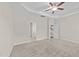Spacious main bedroom with neutral carpet, tray ceiling, and multiple entryways at 85 Twelve Oaks Dr, Willow Springs, NC 27592