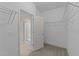 Walk-in closet providing ample storage with wire shelving and easy access to the bathroom at 85 Twelve Oaks Dr, Willow Springs, NC 27592