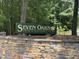 Entrance sign for Seven Oaks Swim & Racquet Club with stone base at 8629 Windjammer Dr, Raleigh, NC 27615