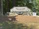 Greystone Swim & Racquet Club sign with rock base and address at 8629 Windjammer Dr, Raleigh, NC 27615