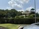 View of a community waterslide surrounded by trees and green space at 8629 Windjammer Dr, Raleigh, NC 27615
