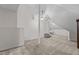 Spacious attic featuring dormers, a ceiling fan, carpeting, and a small stairwell at 9 Piney Grove Rd, Bahama, NC 27503