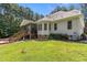 Expansive backyard with a screened porch and well-manicured lawn at 9 Piney Grove Rd, Bahama, NC 27503