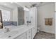 Bathroom featuring double sinks, vanity, large mirror, tub, shower, and toilet at 9 Piney Grove Rd, Bahama, NC 27503