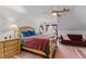 Bedroom featuring a bed, ceiling fan, dresser with mirror, and a sofa at 9 Piney Grove Rd, Bahama, NC 27503