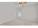 Minimalist bedroom with neutral colors, a ceiling fan, and a window with blinds at 9 Piney Grove Rd, Bahama, NC 27503