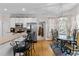 Open-concept kitchen with breakfast bar and stainless steel appliances, connected to dining area at 9 Piney Grove Rd, Bahama, NC 27503