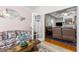 Another view of the living room showcasing floral sofas and a doorway to another living space at 9 Piney Grove Rd, Bahama, NC 27503