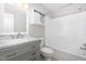 A full bathroom with a vanity and storage, with a tub and shower combination at 908 Snow Hill Rd, Durham, NC 27712