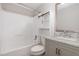 Bathroom featuring a shower-tub combo, built-in shelves, and a vanity with marble countertop at 908 Snow Hill Rd, Durham, NC 27712