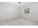 This bedroom is carpeted, featuring a window, and is well-lit with overhead lighting at 908 Snow Hill Rd, Durham, NC 27712