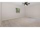 Bedroom featuring neutral colors, ceiling fan, carpeted flooring and window at 908 Snow Hill Rd, Durham, NC 27712