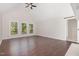 Spacious living room featuring hardwood floors, vaulted ceilings, and large windows overlooking the yard at 908 Snow Hill Rd, Durham, NC 27712