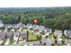 This aerial view shows the neighborhood location of this home, which backs to a lush forest area at 908 Woodland Grove Way, Wake Forest, NC 27587