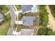 Aerial view shows the property lines and the surrounding landscaping, including the pool and a view of the backyard at 908 Woodland Grove Way, Wake Forest, NC 27587