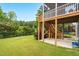 Spacious backyard featuring a fire pit, well maintained lawn, and second story deck at 908 Woodland Grove Way, Wake Forest, NC 27587
