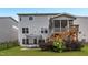 Rear exterior showing a screened deck, trampoline, and fenced backyard at 908 Woodland Grove Way, Wake Forest, NC 27587
